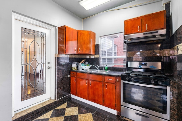 kitchen with sink, stainless steel range with gas cooktop, and tasteful backsplash