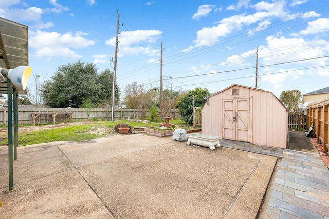 view of patio with a storage shed