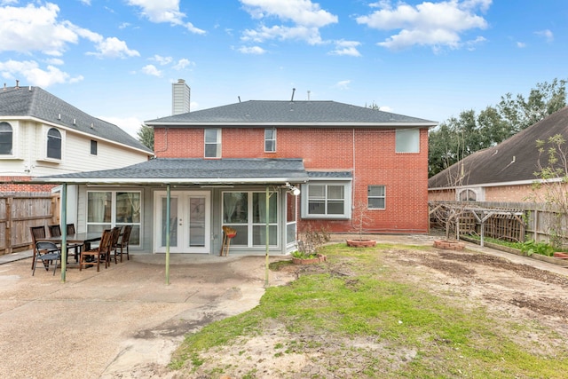 back of house with french doors and a patio