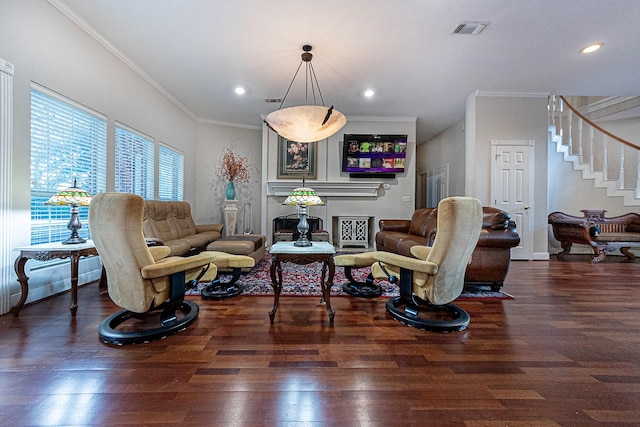 living room featuring ornamental molding and dark wood-type flooring