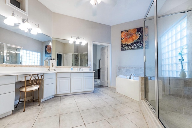 bathroom with tile patterned floors, vanity, and independent shower and bath