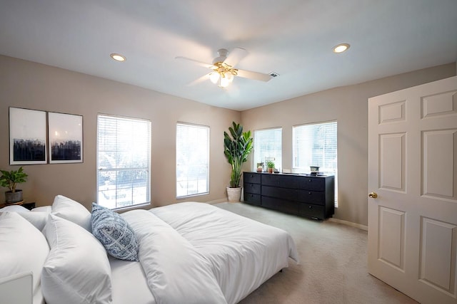 carpeted bedroom with ceiling fan