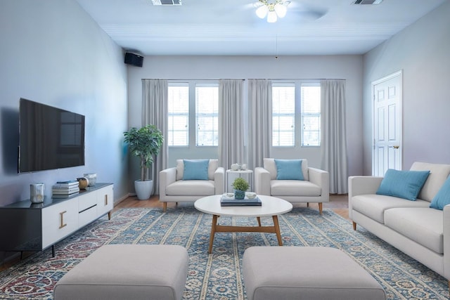 living room featuring hardwood / wood-style floors, plenty of natural light, and ceiling fan