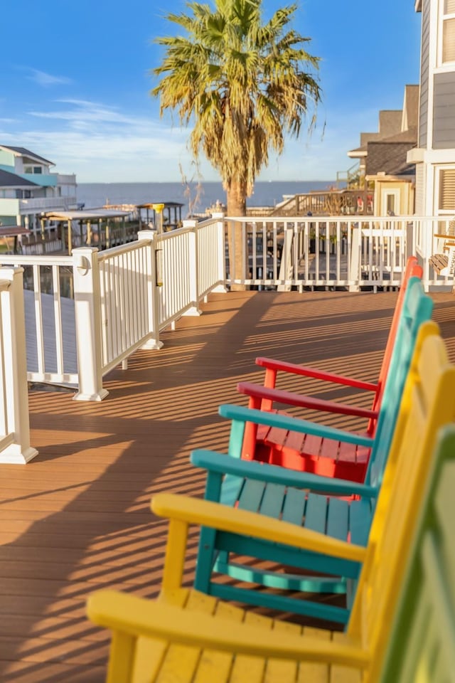 wooden deck featuring a water view