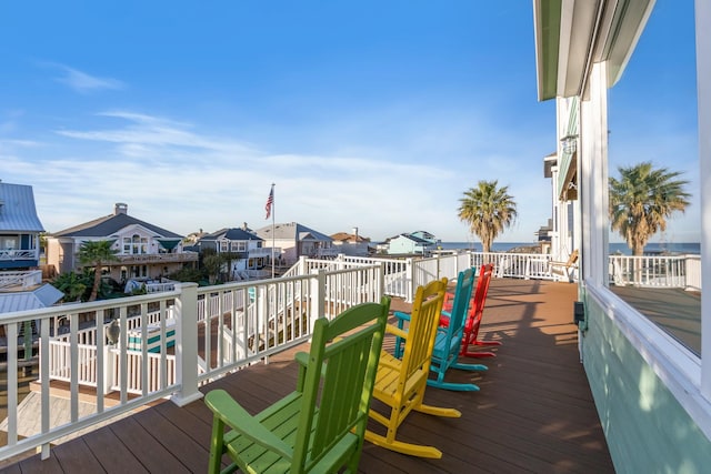 wooden deck with a residential view