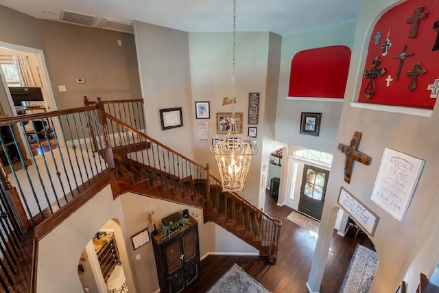 foyer featuring a high ceiling and dark wood-type flooring