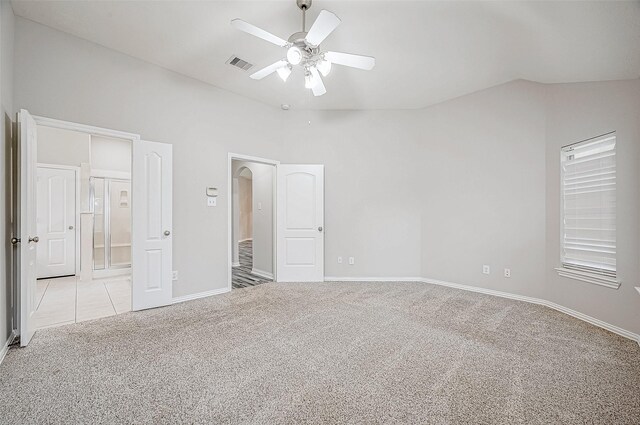 unfurnished bedroom featuring ceiling fan and light carpet