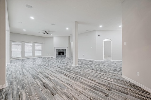 unfurnished living room with light hardwood / wood-style floors and ceiling fan