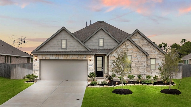 view of front facade featuring a yard and a garage