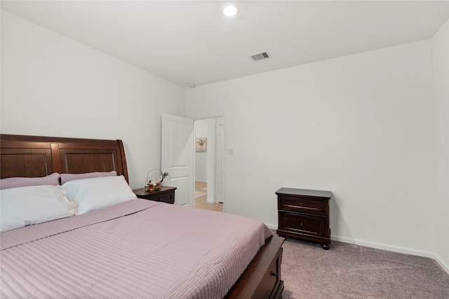 bedroom featuring light colored carpet