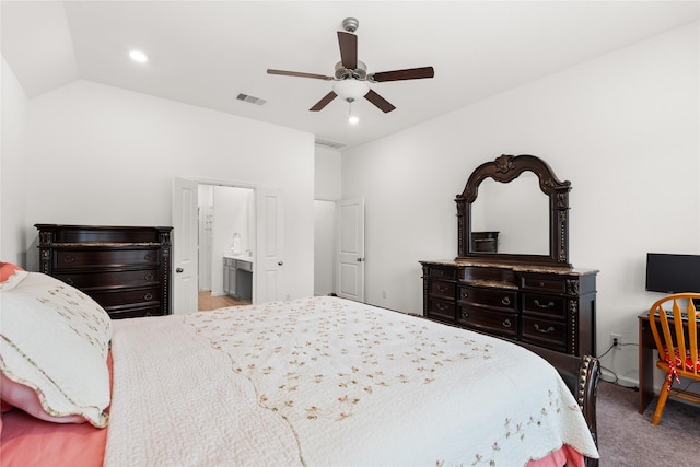 carpeted bedroom with ensuite bath, ceiling fan, and lofted ceiling