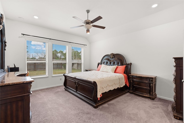 carpeted bedroom featuring vaulted ceiling and ceiling fan