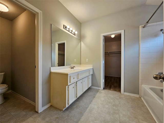 full bathroom featuring vanity,  shower combination, and toilet