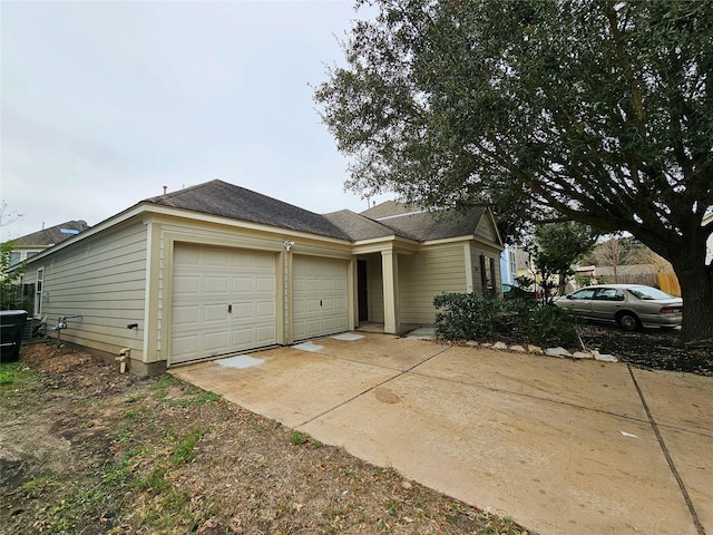 single story home featuring a garage