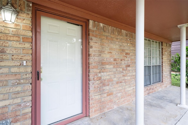 doorway to property featuring covered porch