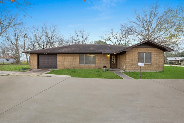 ranch-style home with a front yard and a garage