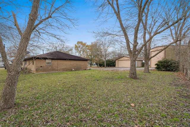 view of yard featuring a garage