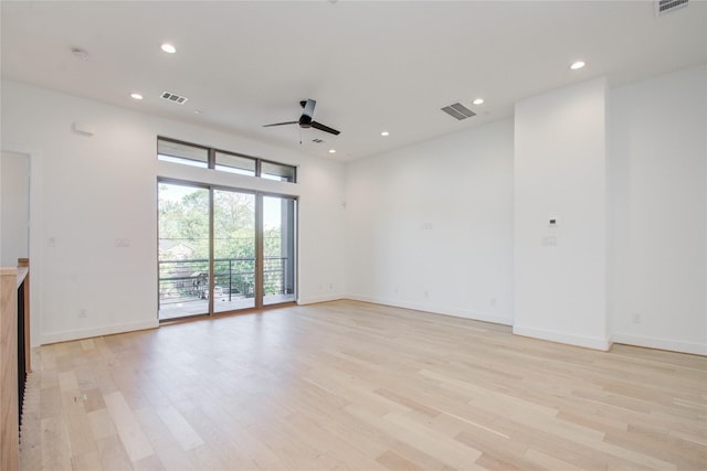 empty room featuring ceiling fan and light hardwood / wood-style flooring