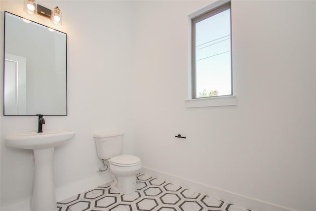 bathroom with toilet and sink