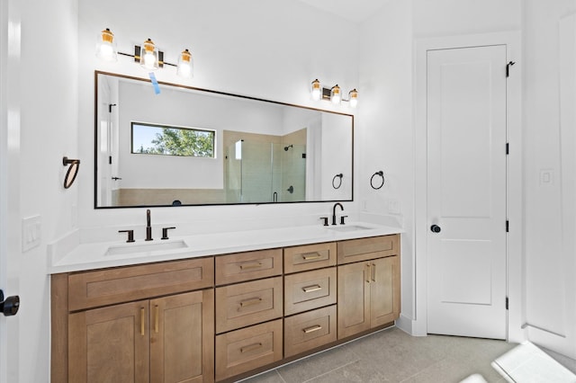 bathroom with vanity, an enclosed shower, and tile patterned flooring