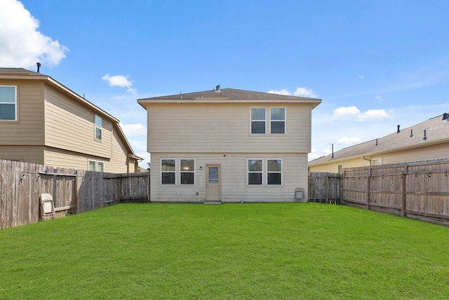 back of house with a yard