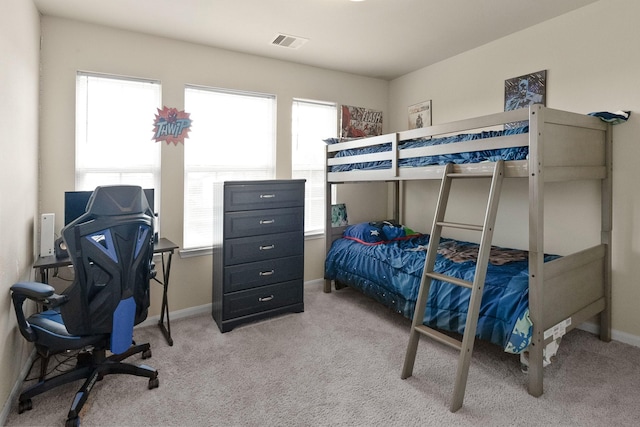 bedroom with light colored carpet