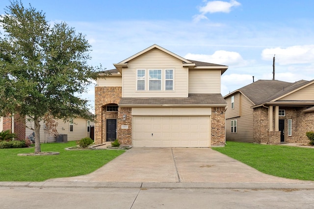 view of front of home with a front lawn and a garage