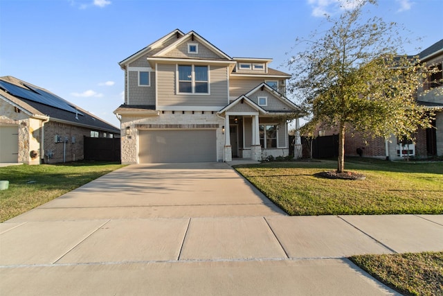 view of front of house with a garage and a front lawn