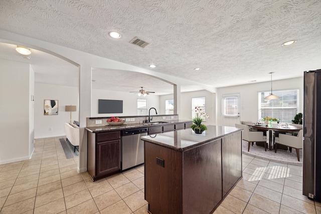 kitchen featuring pendant lighting, sink, ceiling fan, appliances with stainless steel finishes, and dark brown cabinetry