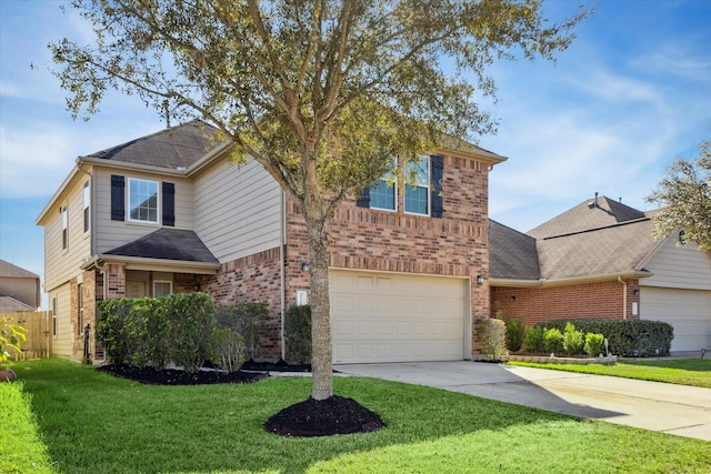 view of property featuring a front yard and a garage