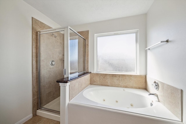 bathroom with separate shower and tub