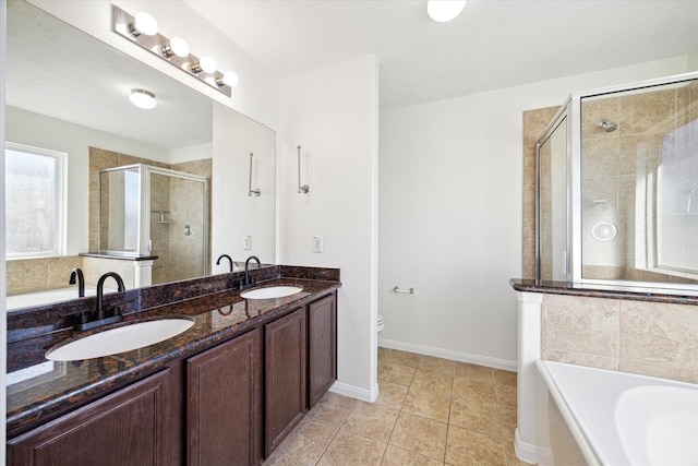 full bathroom featuring vanity, tile patterned flooring, plus walk in shower, and toilet