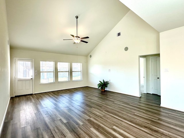 unfurnished living room with dark wood-style flooring, visible vents, ceiling fan, high vaulted ceiling, and baseboards