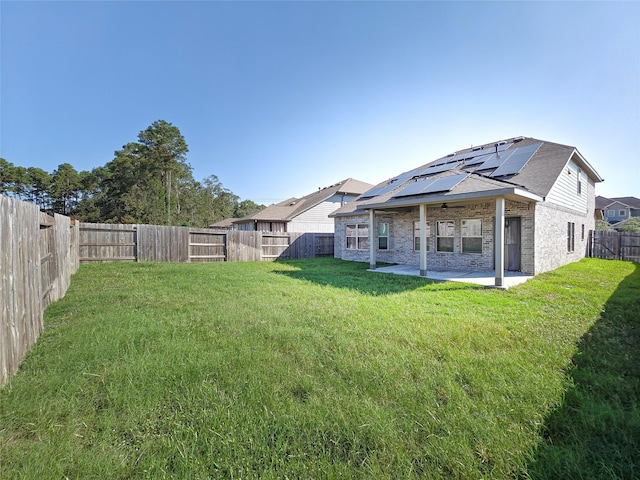 view of yard featuring a patio area and a fenced backyard