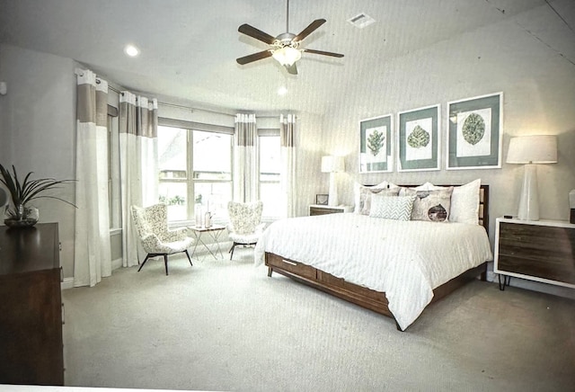 carpeted bedroom featuring a ceiling fan and recessed lighting