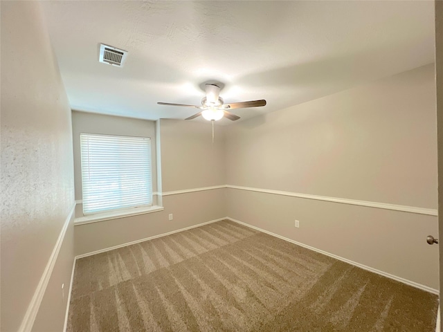 spare room with carpet flooring and ceiling fan