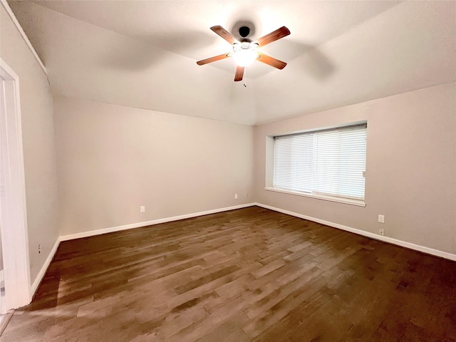 unfurnished room with ceiling fan and dark hardwood / wood-style flooring