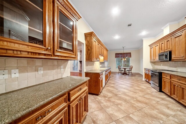 kitchen featuring decorative backsplash, hanging light fixtures, stainless steel appliances, and ornamental molding