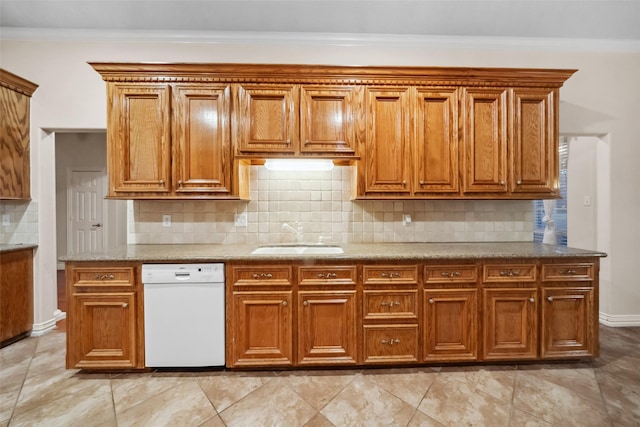 kitchen with dishwasher, tasteful backsplash, ornamental molding, and sink