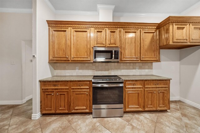 kitchen featuring backsplash, stainless steel appliances, and crown molding