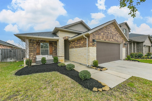 view of front of home featuring a garage and a front yard