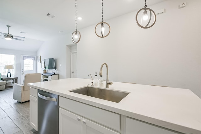 kitchen with stainless steel dishwasher, ceiling fan, sink, white cabinets, and hanging light fixtures