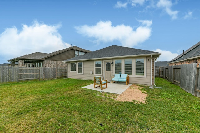 back of property featuring a patio area and a yard