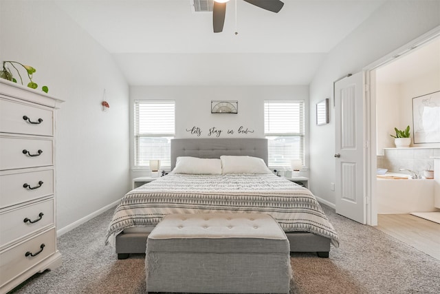 bedroom with dark colored carpet, ceiling fan, and lofted ceiling