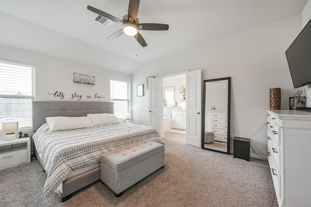 carpeted bedroom featuring connected bathroom, ceiling fan, and lofted ceiling