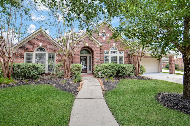 view of front of house with a garage and a front lawn