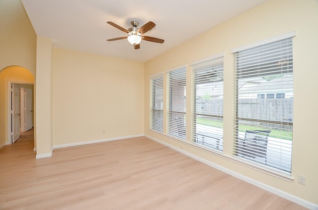 spare room with ceiling fan and light hardwood / wood-style flooring