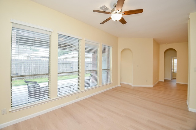 empty room with light hardwood / wood-style floors and ceiling fan