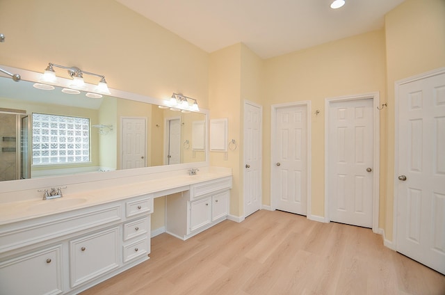 bathroom featuring hardwood / wood-style flooring and vanity