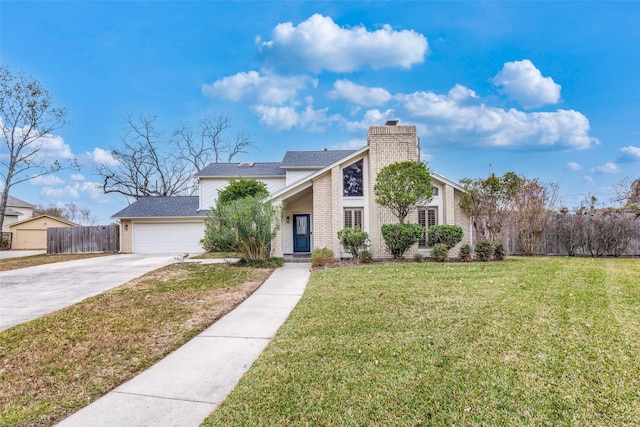 view of front of house featuring a garage and a front lawn